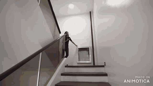a woman is walking up a set of stairs made by animatica