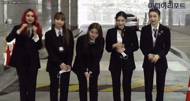a group of women wearing suits and ties are standing next to each other with the words honeycam.org in the upper left corner