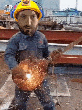 a man wearing a hard hat with work zone on it