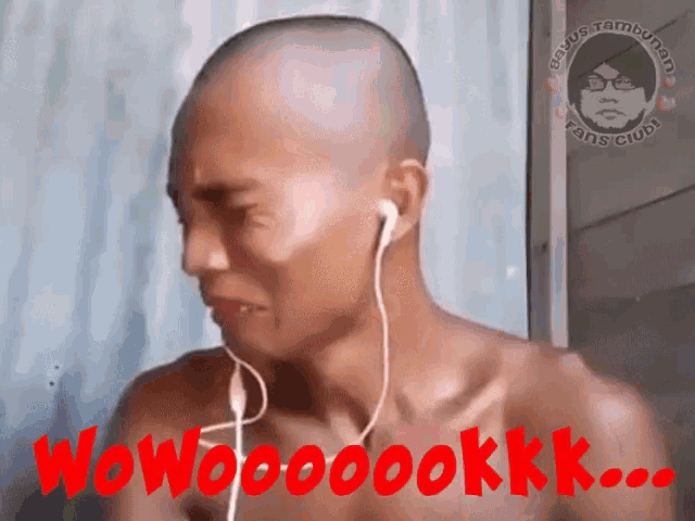 a shirtless man wearing ear buds with the words wow on the bottom