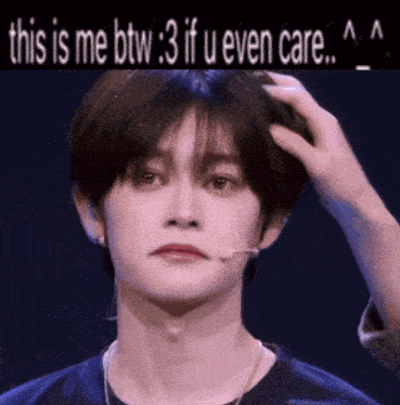 a person is touching a young man 's head with the words " this is me btw 3 if u even care "