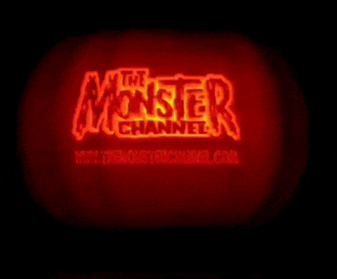 a carved pumpkin with the monster channel written on it
