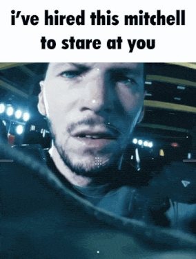 a picture of a man with the words i 've hired this mitchell to stare at you