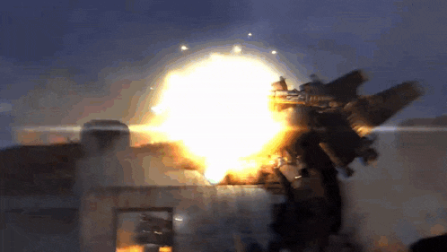 a huge explosion is going off in the dark