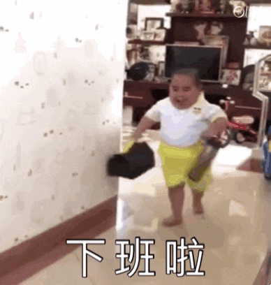 a little boy is walking down a hallway carrying a bag and a bottle .