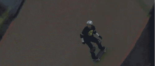 a man wearing a black shirt that says ' sd ' on it is riding a skateboard
