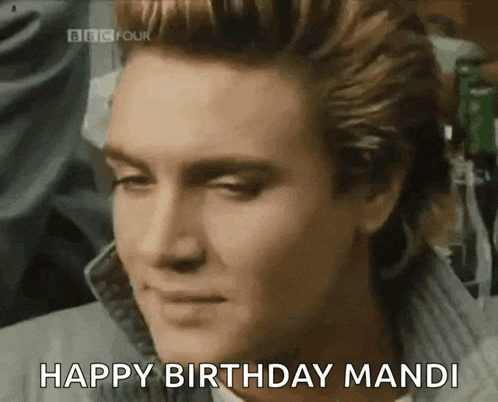 a close up of a man 's face with the words happy birthday mandi above him