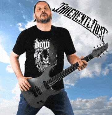 a man is holding a guitar and wearing a shirt that says ' doom ' on it
