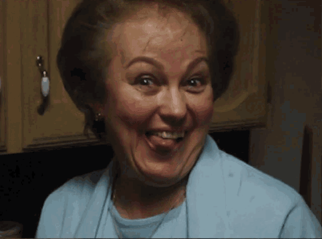 a woman making a funny face with her tongue out
