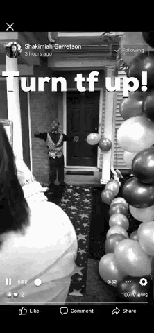 a black and white photo of balloons with the words turn tf up