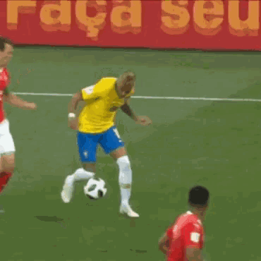 a soccer player with the number 10 on his shorts is trying to get the ball