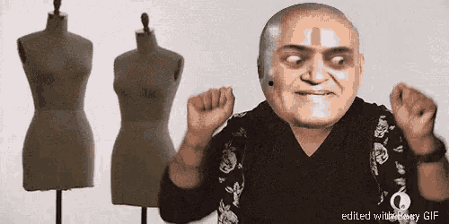 a gif of a bald man dancing with mannequins behind him