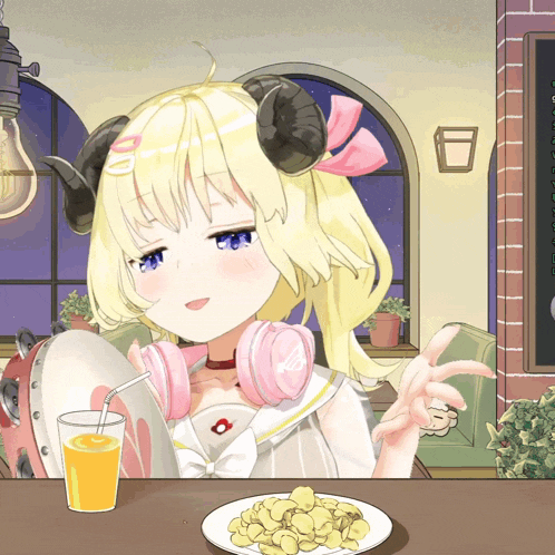 a girl with horns sits at a table with a glass of orange juice