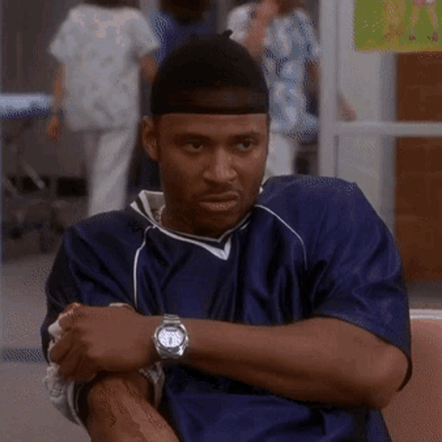 a man with a watch on his wrist shows the time as 7:15