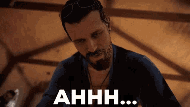 a man with a beard and sunglasses says ahhh in white letters