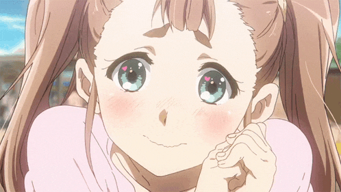 a close up of a girl 's face with hearts on her eyes