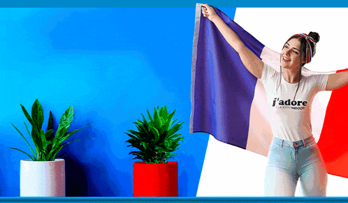 a woman wearing a t-shirt that says ' j'adore ' on it holds a french flag