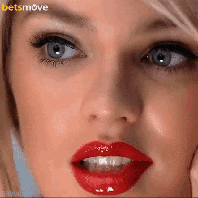 a close up of a woman 's face with a betsmove logo on the bottom