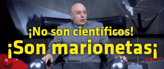 a bald man is sitting at a desk with the words no son cientificos son marionetas