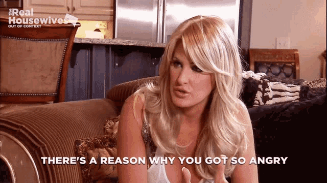 a woman sitting on a couch with the words there 's a reason why you got so angry below her