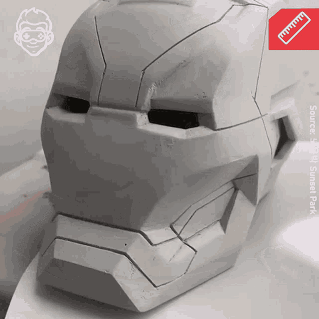 a picture of an iron man helmet with a ruler next to it that says source sunset park