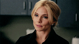 a close up of a woman 's face with blonde hair