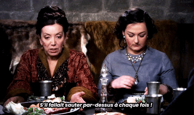 two women sitting at a table with a caption that says " s'il fallait sauter par-dessous a chaque fois