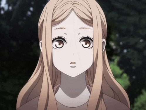 a close up of a girl 's face with long hair and brown eyes
