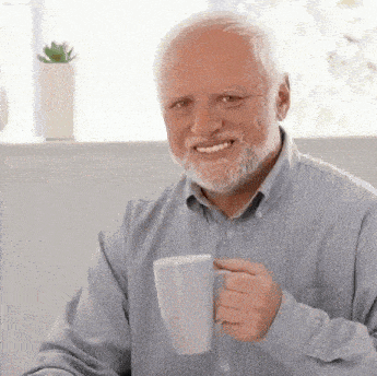 an elderly man with a beard is holding a cup of coffee .