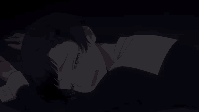 a girl is laying down with her eyes closed