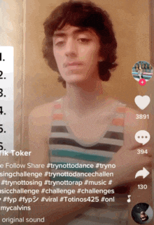 a young man is standing with his arms crossed on a tik tok