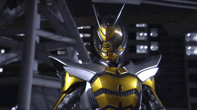 a man in a black and gold armor with a helmet on