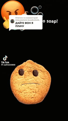 a cookie with tears coming out of it 's eyes and a soap dispenser behind it