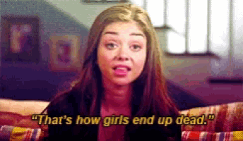 a girl is sitting on a couch and says that 's how girls end up dead