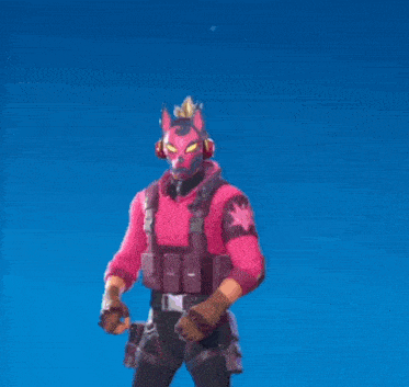 a man in a pink mask is holding a pair of scissors in his hand .