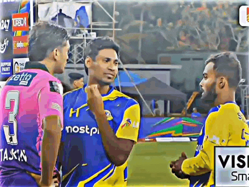 a man wearing a number 3 jersey talks to another man
