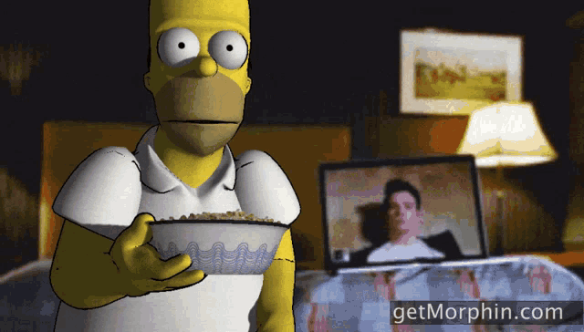 homer simpson is holding a bowl of cereal in front of a laptop screen