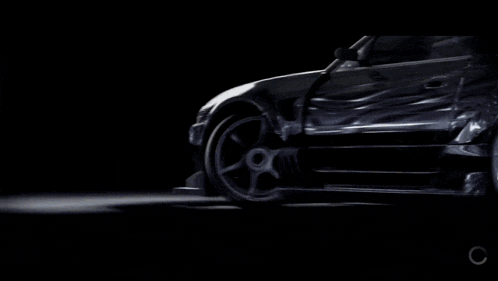 a car with smoke coming out of the tires