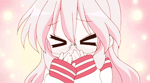 a girl with pink hair and glasses covering her face with her hands