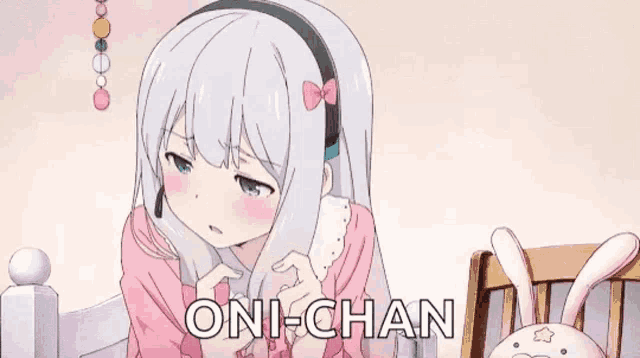 a girl wearing headphones and a headset says oni-chan