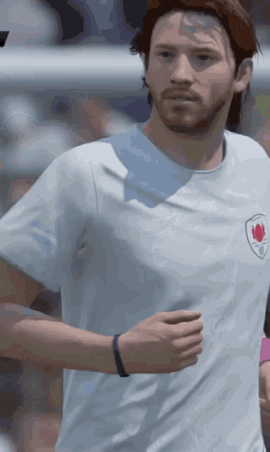 a man with a beard wears a white shirt with a red flower on it