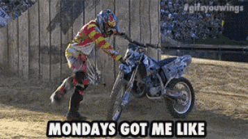 a man on a dirt bike with the words monday 's got me like on the bottom