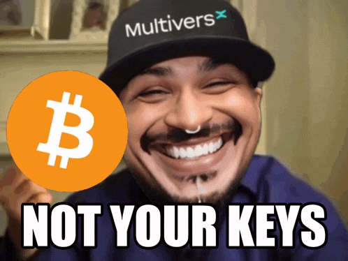a man wearing a hat that says multivers holds a bitcoin sign