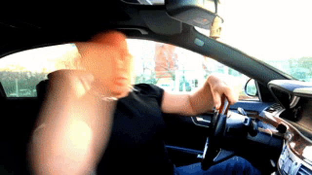a blurry picture of a man in a car