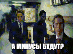 three men in suits and ties are walking down a hallway and one of them is wearing headphones and says " a minus "