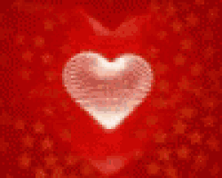 a heart is glowing in the dark on a black background .