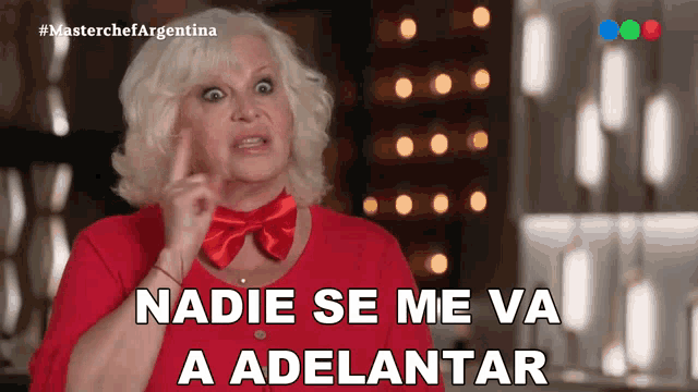 a woman wearing a red shirt and a red bow tie says " nadie se me va a adelantar "