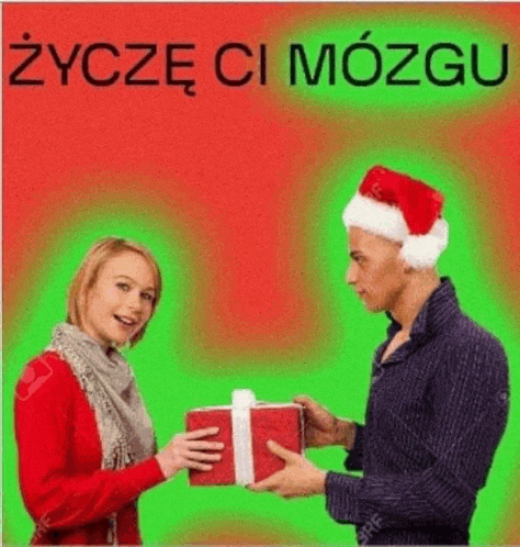 a man in a santa hat is giving a woman a present .