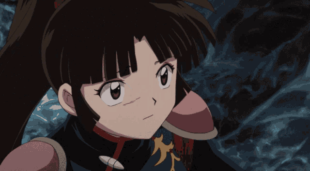 a close up of a cartoon character 's face with a dark background