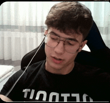 a young man wearing glasses and a t-shirt that says ' timot ' on it